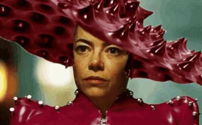 A Woman Wearing A Red Hat And A Red Latex Dress GIF