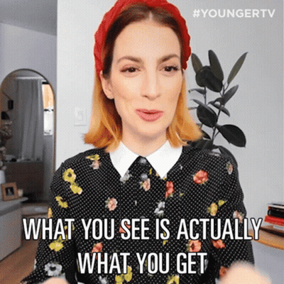 A Woman Wearing A Red Headband And A Polka Dot Shirt Says What You See Is Actually What You Get GIF