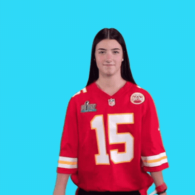 A Woman Wearing A Red Jersey With The Number 15 On It Is Dancing GIF