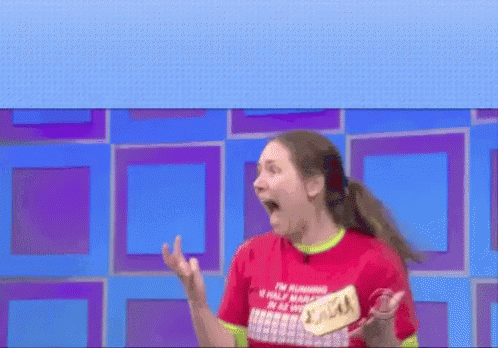 A Woman Wearing A Red Shirt That Says I 'M The Plumber 'S Wife GIF