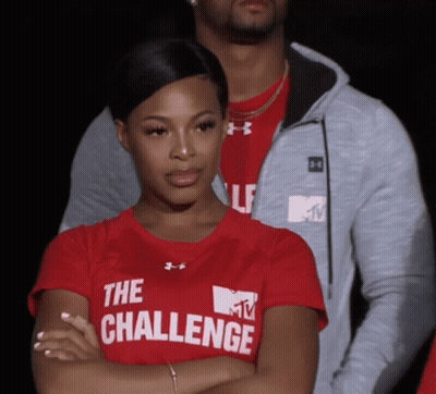A Woman Wearing A Red Shirt That Says The Challenge On It GIF
