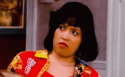 A Woman Wearing A Red Shirt With A Patch That Says ' A ' On It GIF