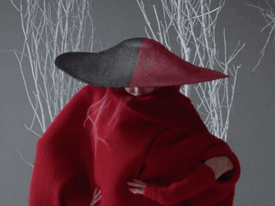 A Woman Wearing A Red Sweater And A Red Hat GIF