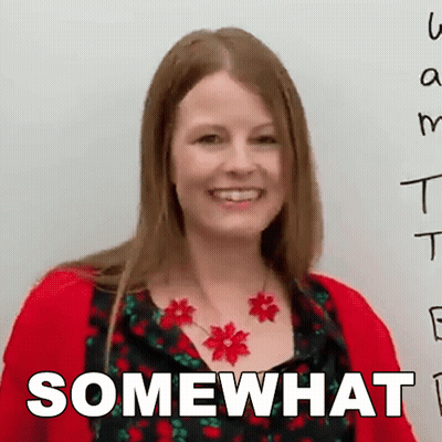 A Woman Wearing A Red Sweater And A Red Necklace Is Smiling And Says Somewhat GIF