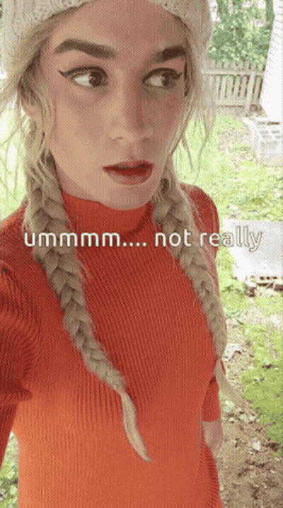 A Woman Wearing A Red Sweater And A White Hat Says " Ummm ... Not Really " GIF