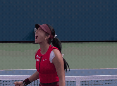 A Woman Wearing A Red Tank Top And A Visor With The Word Nike On It GIF
