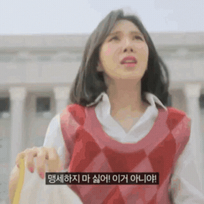 A Woman Wearing A Red Vest And A White Shirt Is Holding A Yellow Object . GIF