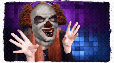 A Woman Wearing A Scary Clown Mask Is Making A Face GIF