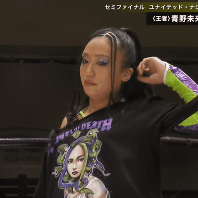 A Woman Wearing A Shirt That Says Angel Of Death GIF