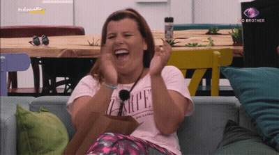 A Woman Wearing A Shirt That Says Carpe Is Laughing GIF