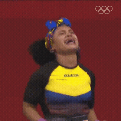 A Woman Wearing A Shirt That Says Ecuador Is Raising Her Arms In The Air GIF