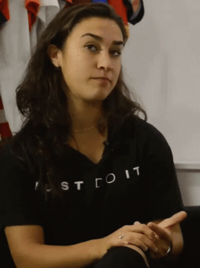 A Woman Wearing A Shirt That Says Just Do It On It GIF