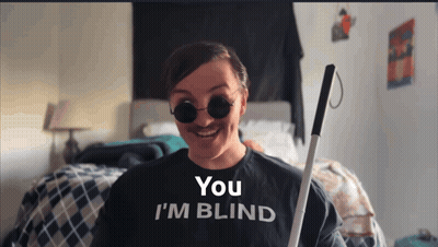 A Woman Wearing A Shirt That Says You 'Re Blind GIF