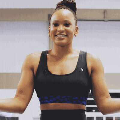 A Woman Wearing A Sports Bra With The Letter A On The Front GIF