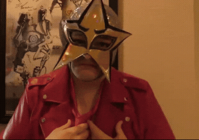 A Woman Wearing A Star Mask And A Red Leather Jacket GIF