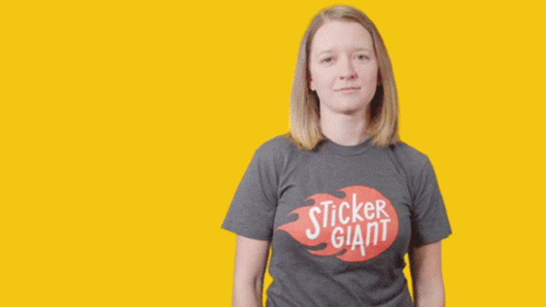A Woman Wearing A Sticker Giant Shirt Is Smiling GIF