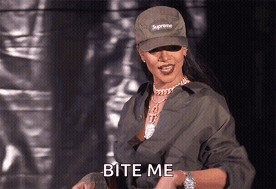 A Woman Wearing A Supreme Hat And A Watch Says Bite Me GIF