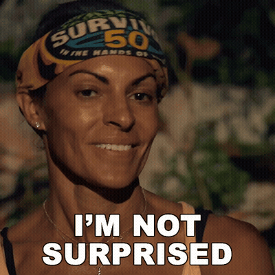 A Woman Wearing A Survivor 50 Headband Is Smiling And Says I 'M Not Surprised GIF