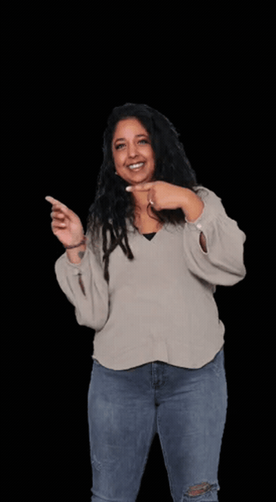 A Woman Wearing A Sweater And Jeans Is Pointing At Herself . GIF