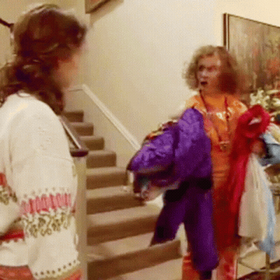 A Woman Wearing A Sweater That Says ' Christmas Sweater ' On It GIF