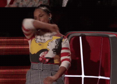 A Woman Wearing A Sweater That Says ' I 'M Sorry ' On It GIF
