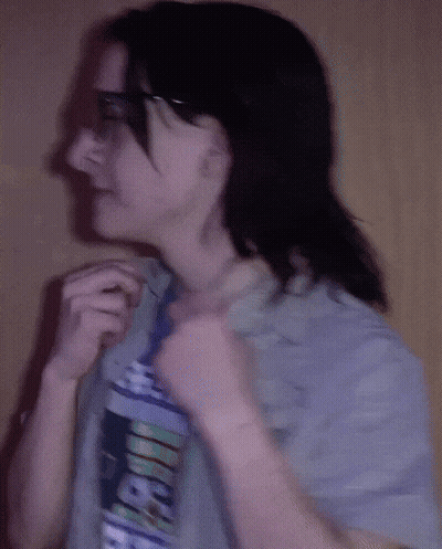 A Woman Wearing A T-Shirt That Says Aeeicf On It GIF