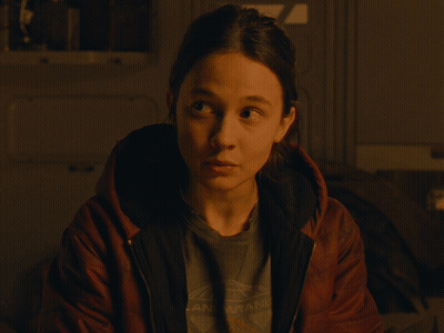 A Woman Wearing A T-Shirt That Says " Arkansas " On It GIF