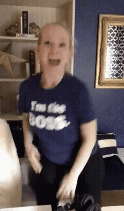 A Woman Wearing A T-Shirt That Says I 'M The Boss GIF