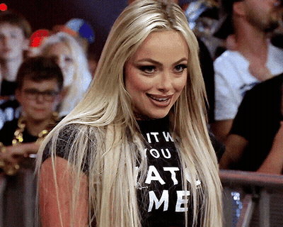 A Woman Wearing A T-Shirt That Says " It 'S You At Me " GIF