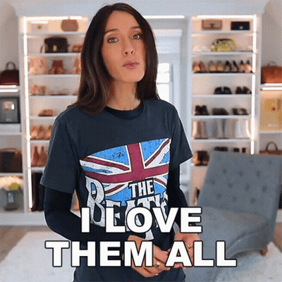 A Woman Wearing A T-Shirt That Says The Beatles I Love Them All GIF