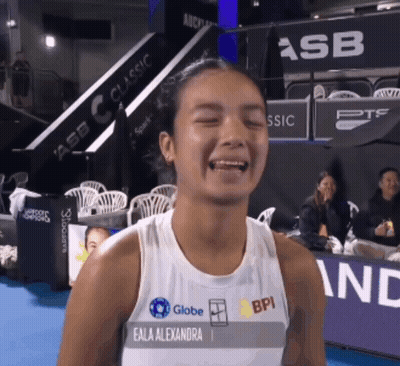 A Woman Wearing A Tank Top That Says Eala Alexandra GIF