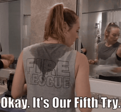 A Woman Wearing A Tank Top That Says Fire Rescue On It GIF