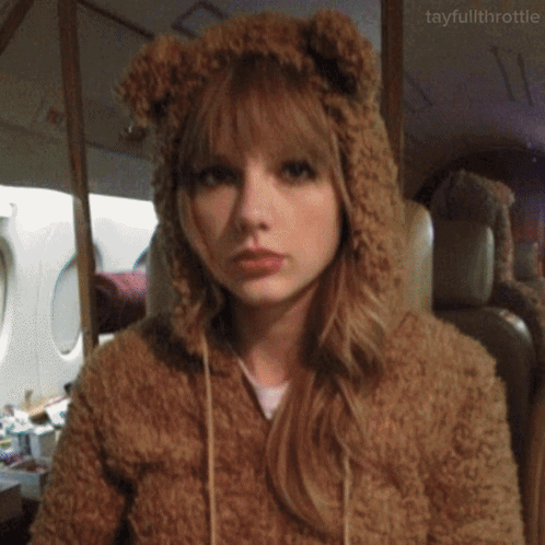 A Woman Wearing A Teddy Bear Hoodie With Ears GIF