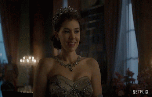 A Woman Wearing A Tiara And A Necklace With The Word Netflix On The Bottom Right GIF
