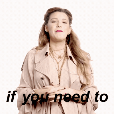 A Woman Wearing A Trench Coat And Necklaces Says If You Need To GIF