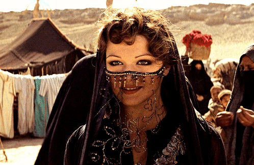 A Woman Wearing A Veil With A Tattoo On Her Neck GIF