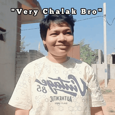 A Woman Wearing A Very Chalak Bro T-Shirt Smiles For The Camera GIF