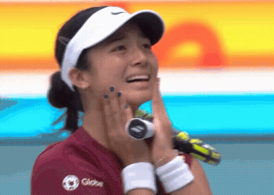 A Woman Wearing A Visor And A Shirt That Says Globo GIF