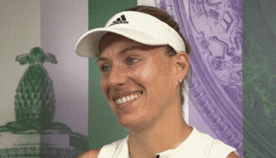 A Woman Wearing A White Adidas Hat Smiles GIF