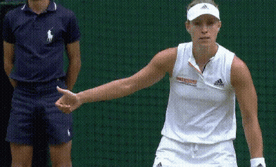 A Woman Wearing A White Adidas Shirt Stands In Front Of A Green Net GIF