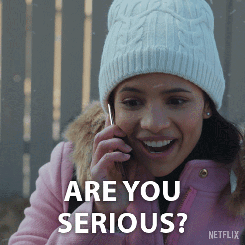 A Woman Wearing A White Hat And A Pink Jacket Is Talking On A Cell Phone And The Words Are You Serious Are On The Bottom GIF