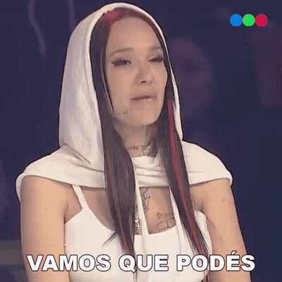 A Woman Wearing A White Hooded Top Says Vamos Que Podes GIF