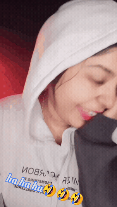 A Woman Wearing A White Hoodie That Says " Ha Ha Ha " On It GIF