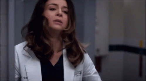 A Woman Wearing A White Lab Coat With The Name Kylee On The Front GIF