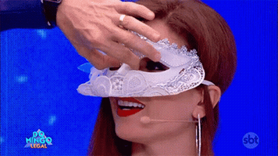 A Woman Wearing A White Mask With A Sbt Logo On The Bottom Right GIF
