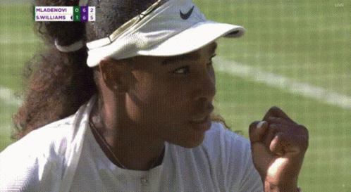 A Woman Wearing A White Nike Visor Is Watching A Tennis Match Between Mladenovi And S. Williams GIF