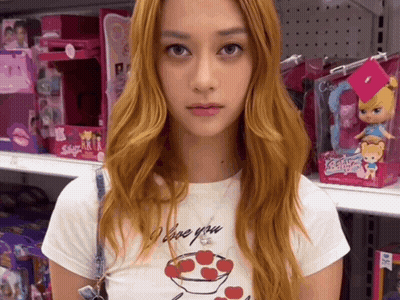 A Woman Wearing A White Shirt That Says I Love You GIF