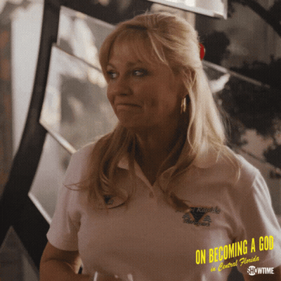A Woman Wearing A White Shirt That Says On Becoming A God In Central Florida GIF