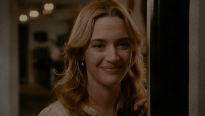 A Woman Wearing A White Shirt With A Black Lace Collar GIF