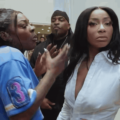 A Woman Wearing A White Shirt With The Number 3 On The Sleeve GIF